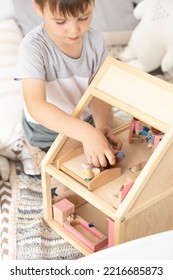 Non Binary Diverse Male Kid Playing Wooden Dolls House Enjoy Happy Childhood At Home Room Interior. Baby Boy Early Development Toy Game Girlish Plaything. Gender Individuality Freedom Choice Tolerance