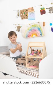 Non Binary Diverse Male Kid Playing Wooden Dolls House Enjoy Happy Childhood At Home Room Interior. Baby Boy Early Development Toy Game Girlish Plaything. Gender Individuality Freedom Choice Tolerance