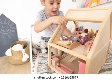 Non Binary Diverse Male Kid Playing Wooden Dolls House Enjoy Happy Childhood At Home Room Interior. Baby Boy Early Development Toy Game Girlish Plaything. Gender Individuality Freedom Choice Tolerance