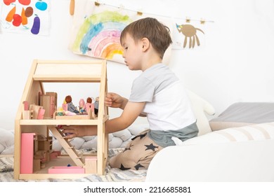 Non Binary Diverse Male Kid Playing Wooden Dolls House Enjoy Happy Childhood At Home Room Interior. Baby Boy Early Development Toy Game Girlish Plaything. Gender Individuality Freedom Choice Tolerance