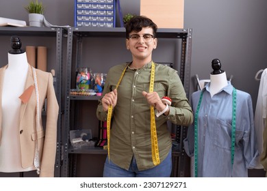 Non binary man tailor smiling confident standing at atelier