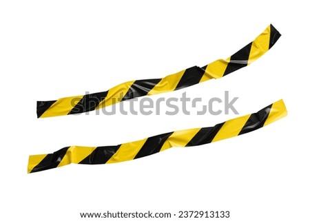 Non straight yellow and black barricade tape on white background with clipping path