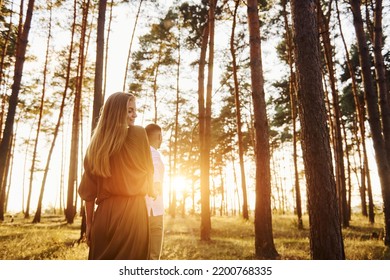 Non Urban Scene. Happy Couple Is Outdoors In The Forest At Daytime.