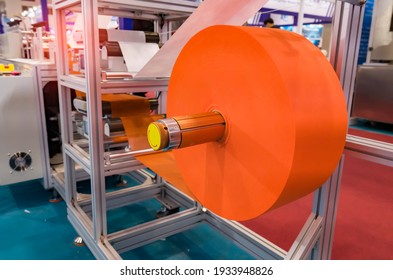 non woven material on automatic machine for the manufacture of medical masks with nanofiber. Coronavirus and Covid-19 Protection