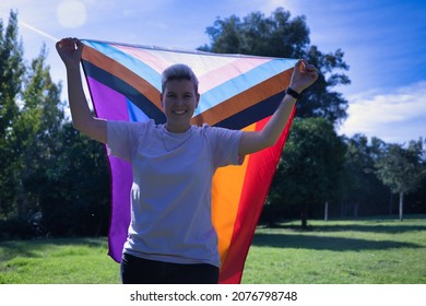 Non-binary Person, Raising With Hands The New Lgbtq Pride Flag. Non-binary Concept, Lgbtq+, Inclusion, Gay, Lesbian, Lgbtq.