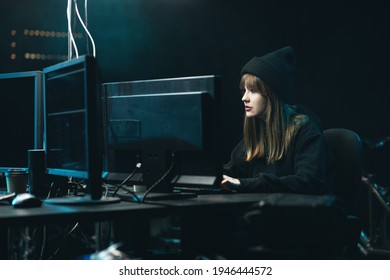 Nonconformist Teenage Hacker Girl Attacks Corporate Servers Using Her Computer. Female Hacker Drinking Coffee.