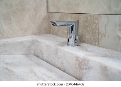 Non-contact, infrared sink faucet. plumbing for bathrooms and public restrooms. classic interior and modern details. - Shutterstock ID 2040446402