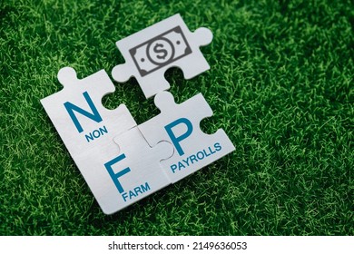 Nonfarm Payrolls - Key Economic Indicator. Natural Family Planning Concept. Nonfarm Payrolls On Jigsaw Puzzles On A Green Artificial Grass Background.