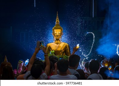NONGKHAI THAILAND APRIL 17 , 2016 : Songkran Festival, Many people have raised the buddha statues Luang Pho Phra Sai joined parade to pray closely at Nongkhai Thailand.