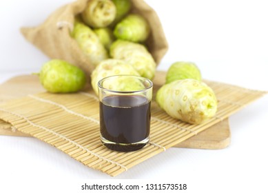 Noni juice or noni juice extracted  on bamboo mat or morinda juice .