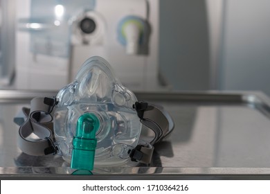 Non-invasive Ventilation Face Mask, On Background Medical Ventilator In ICU In Hospital. 
