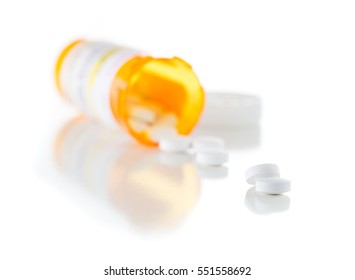 Non-Proprietary Medicine Prescription Bottle And Spilled Pills Isolated On A White Background. This Label Contains Only Fictitious Information.