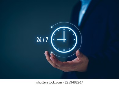 nonstop service concept. businessman show virtual 24-7 with clock for worldwide nonstop and full-time available contact of customer service concept. digital online customer service on internet network
