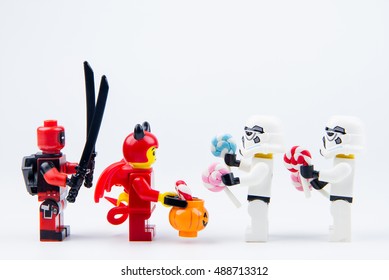 Nonthabure, Thailand - September, 24, 2016 : Lego ghost halloween and Lego deadpool want halloween candy Trick or Treat with Lego star wars stormtrooper.Theme Halloween background.