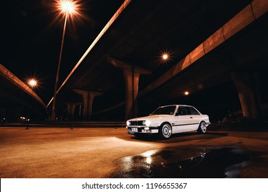 Nonthaburi, Oct 2018 : White Classical Car BMW E30 3-series , BBS RS3 Wheel With Light Painting Photography Skill.