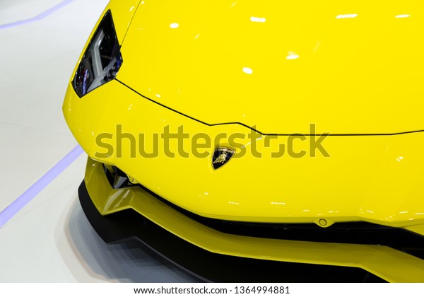 Nonthaburi , Thailand - April 3, 2019: close up\
car bonnet and logo of Lamborghini Aventador yellow super sports\
cars presented in motor show\
.