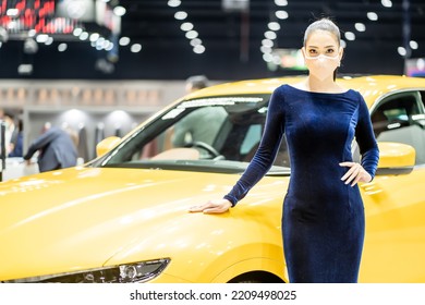 Nonthaburi, Thailand - DEC 4, 2021 - Unidentified Model Poses With A Car At The 38th Motor Expo Thailand 2021 At IMPACT Arena, Muang Thong Thani, Nonthaburi, Thailand.