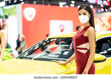 Nonthaburi, Thailand - DEC 4, 2021 - Unidentified Model Poses With A Car At The 38th Motor Expo Thailand 2021 At IMPACT Arena, Muang Thong Thani, Nonthaburi, Thailand.