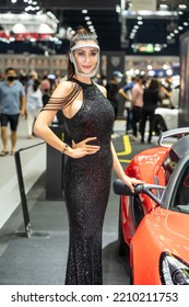 Nonthaburi, Thailand - DEC 4, 2021 - Unidentified Model Poses With A Car At The 38th Motor Expo Thailand 2021 At IMPACT Arena, Muang Thong Thani, Nonthaburi, Thailand.