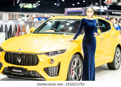 Nonthaburi, Thailand - DEC 4, 2021 - Unidentified Model Poses With A Car At The 38th Motor Expo Thailand 2021 At IMPACT Arena, Muang Thong Thani, Nonthaburi, Thailand.