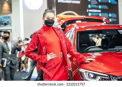 Nonthaburi, Thailand - DEC 4, 2021 - Unidentified Model Poses With A Car At The 38th Motor Expo Thailand 2021 At IMPACT Arena, Muang Thong Thani, Nonthaburi, Thailand.