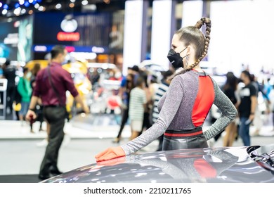 Nonthaburi, Thailand - DEC 4, 2021 - Unidentified Model Poses With A Car At The 38th Motor Expo Thailand 2021 At IMPACT Arena, Muang Thong Thani, Nonthaburi, Thailand.