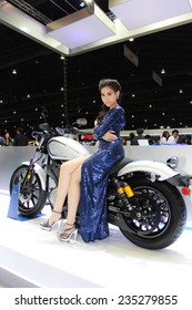 Nonthaburi, Thailand - November 28, 2014: Unidentified model  with YAMAHA pose in the 31th  Thailand International Motor Expo on November 28, 2014 in Nonthaburi, Thailand.