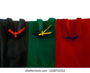 Non-woven Cloth Tote Bag Isolated On White. Three Bundles Of Black, Green And Red Bag Product Samples