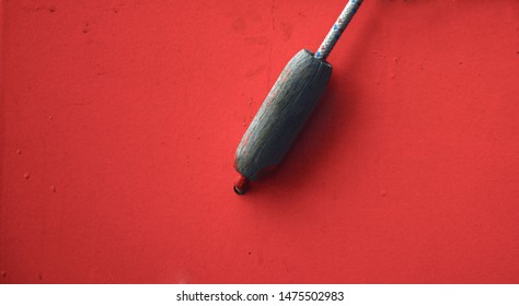 nonymous object on red background, minimal background