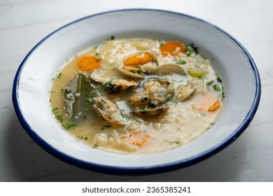Noodle soup with clams and carrots and other seasonal vegetables. - Shutterstock ID 2365385241