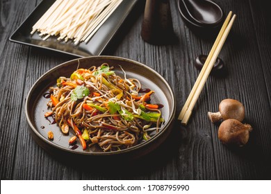 Noodles with beef, carrots, onions and sweet peppers. Asian food. Top view - Shutterstock ID 1708795990