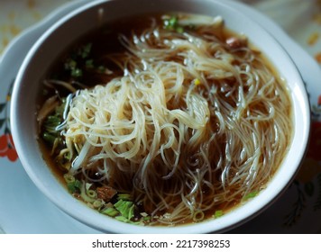 Noodles With Brown Gravy At An Asian Restaurant