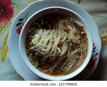 Noodles With Brown Gravy At An Asian Restaurant