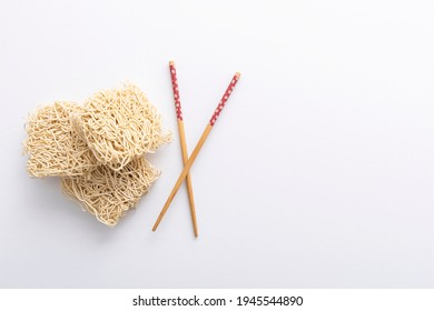 Noodles isolated on white background. Raw noodles - Shutterstock ID 1945544890