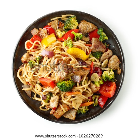 Noodles with meat and vegetables isolated on white background, top view