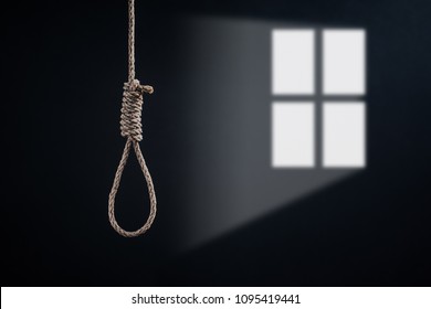the noose with windows light against the glum background, homicide or commit suicide concept