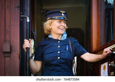 NORA, SWEDEN - AUGUST 27, 2016: Female Train Conductor On Old Train In Nora, Sweden 