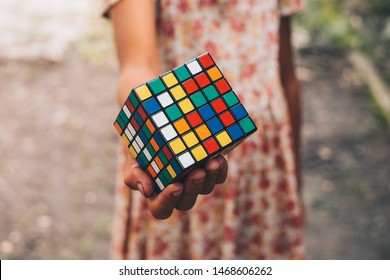 NORALA, PH – JUN 16, 2019: Rubik's Cube Was Invented In 1974 By Hungarian Sculptor And Professor Of Architecture Erno Rubik. Hand Of A Young Girl Holding The Cube.