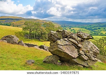 The Norber Erratics are one of the finest groups of glacial erratic boulders in Britain, close to the village of Austwick, in the Yorkshire Dales, England.