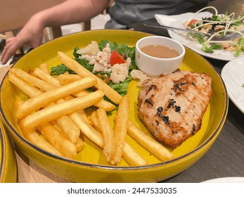 Nordic food includes grilled meat and fries. - Powered by Shutterstock