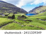 Nordic natural landscape, Saksun, Stremnoy island, Faroe Islands, Denmark. Iconic green roof houses.