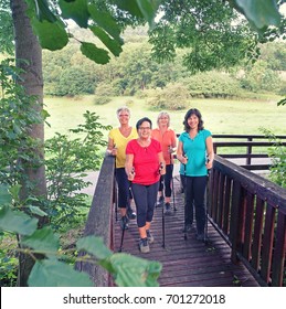 Nordic Walking - Active Woman Group Exercising Outdoor