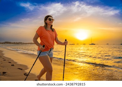 Nordic walking - beautiful woman exercising on tropical beach - Powered by Shutterstock