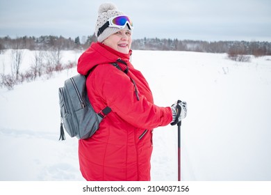 Nordic Walking In Winter. Grandma Goes In For Sports.