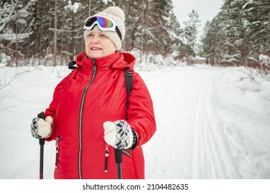 Nordic Walking In Winter. Grandma Goes In For Sports.