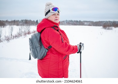 Nordic Walking In Winter. Grandma Goes In For Sports.