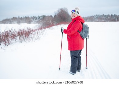 Nordic Walking In Winter. Grandma Goes In For Sports.