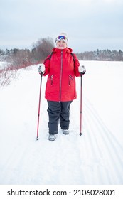 Nordic Walking In Winter. Grandma Goes In For Sports.