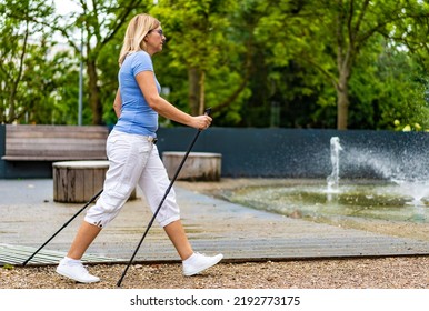Nordic Walking - Woman Training In City Park