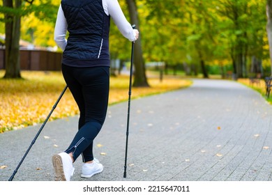 Nordic Walking - Woman Training In City Park 